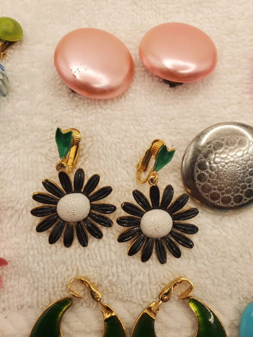 12 Pair of clip on earrings, items # B-2106-2117,.  wt. 123 grams.
